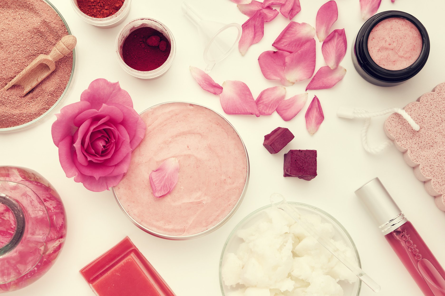 Organic Beauty Products with Pink Rose Flower Top View 